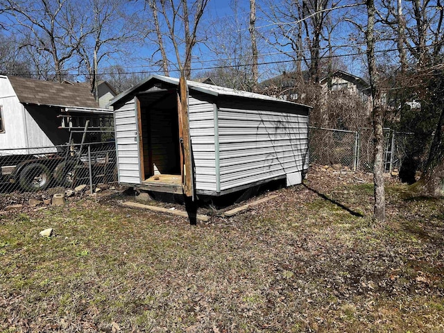 view of shed with fence