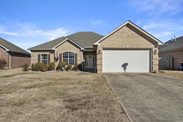 ranch-style home featuring brick siding, concrete driveway, an attached garage, and a shingled roof