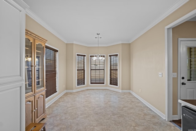 unfurnished dining area featuring crown molding, baseboards, and a chandelier