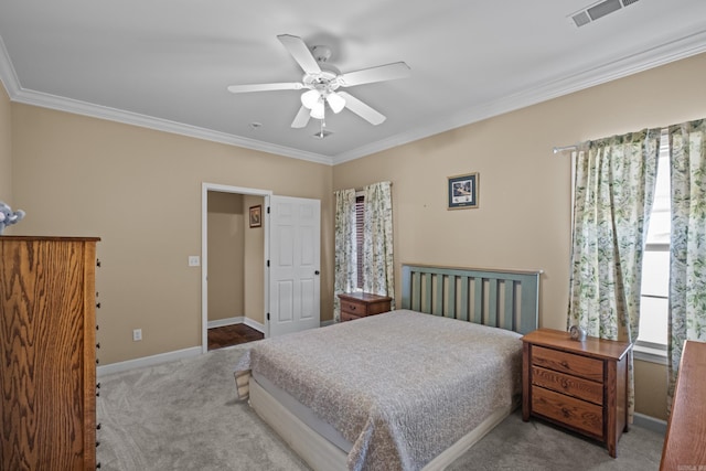 bedroom featuring crown molding, carpet flooring, baseboards, and visible vents