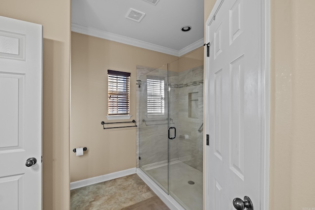 full bath featuring a stall shower, visible vents, baseboards, and ornamental molding