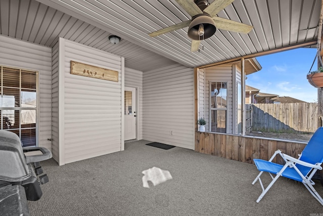 view of patio / terrace featuring ceiling fan and fence