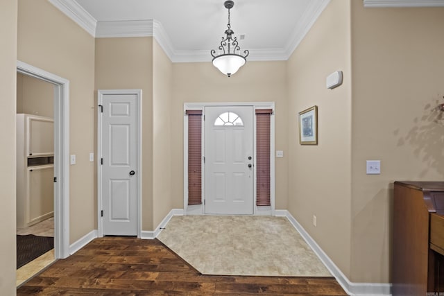 entryway with dark wood-style floors, baseboards, and ornamental molding