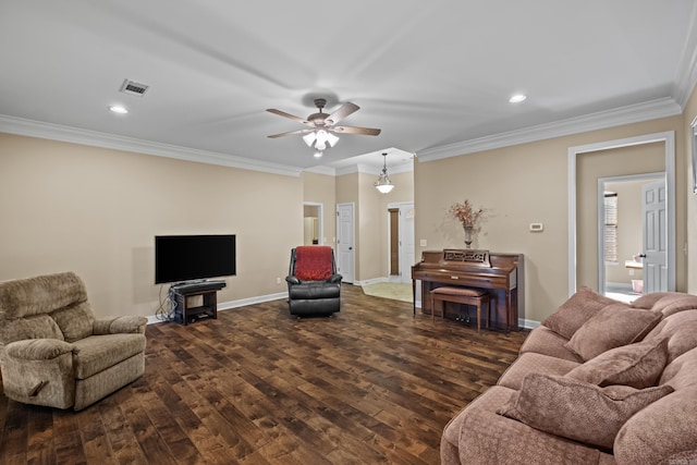 living area featuring dark wood finished floors, visible vents, baseboards, and ornamental molding