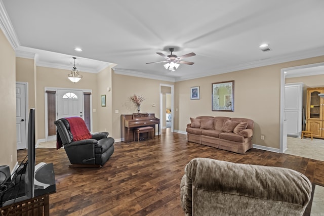 living area featuring dark wood finished floors, baseboards, and ornamental molding