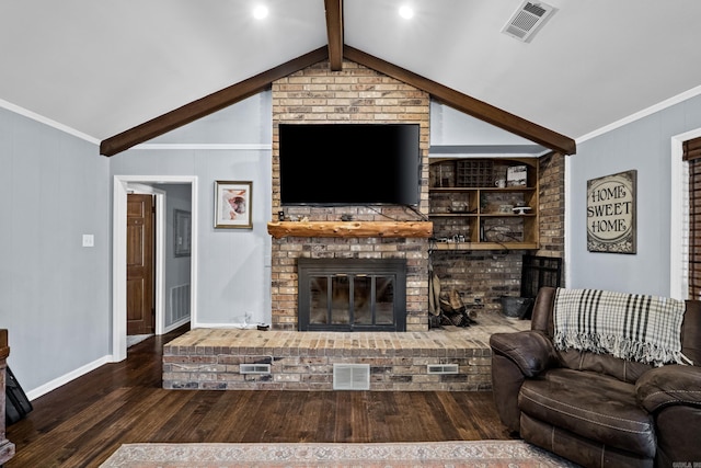 living room with wood finished floors, visible vents, lofted ceiling with beams, a fireplace, and crown molding