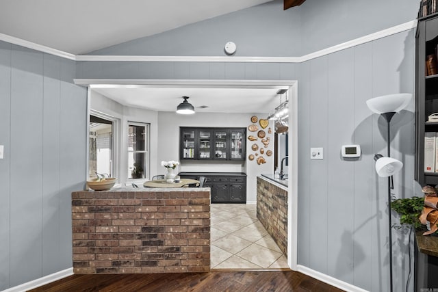 kitchen featuring lofted ceiling and wood finished floors