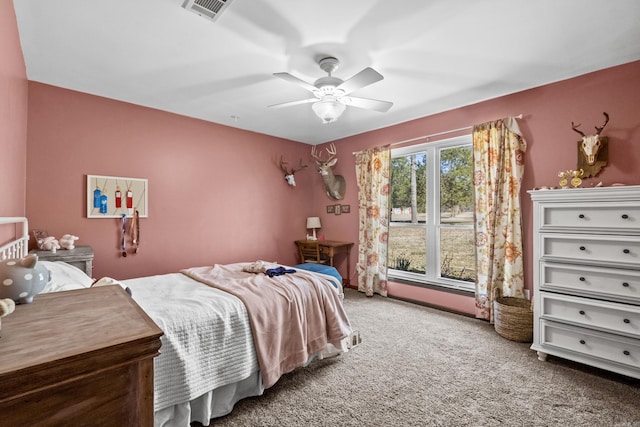 carpeted bedroom featuring visible vents and ceiling fan