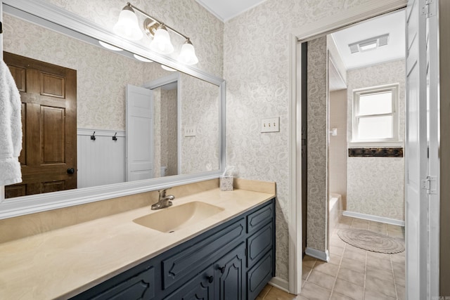 full bathroom with visible vents, wallpapered walls, wainscoting, tile patterned flooring, and vanity