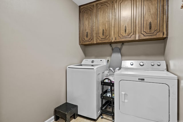 laundry area featuring cabinet space and independent washer and dryer