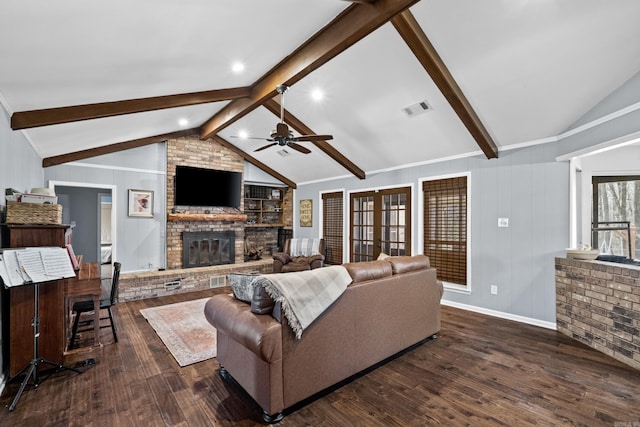 living area with visible vents, a brick fireplace, vaulted ceiling with beams, dark wood finished floors, and a ceiling fan