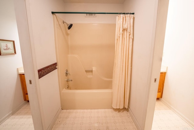 full bath with vanity, tile patterned floors, and shower / tub combo