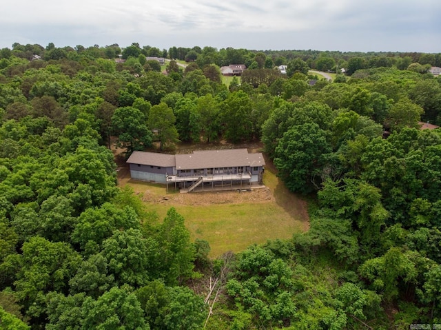 bird's eye view featuring a wooded view