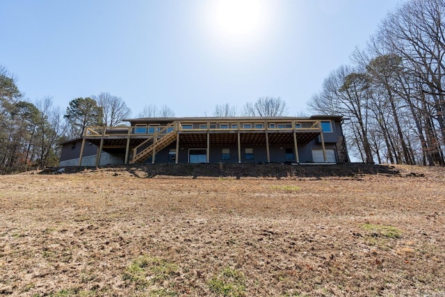 back of house with a deck and stairway