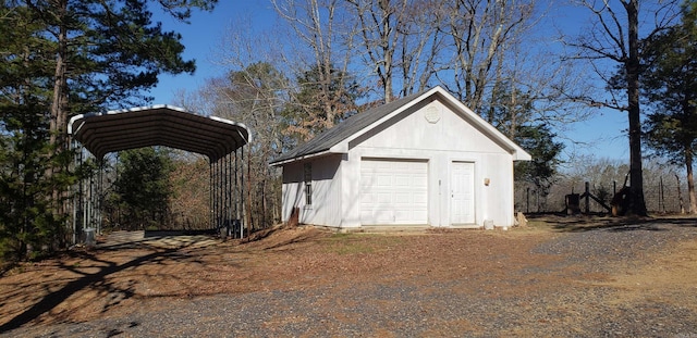 garage featuring a detached carport