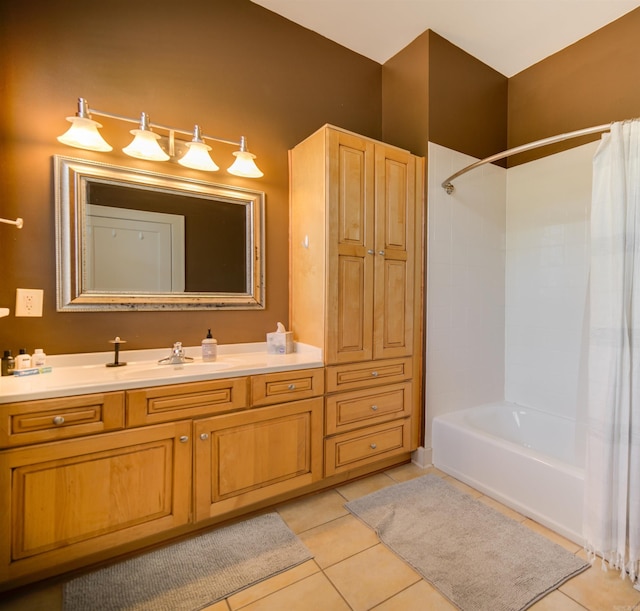 bathroom featuring tile patterned flooring, vanity, and shower / bath combo