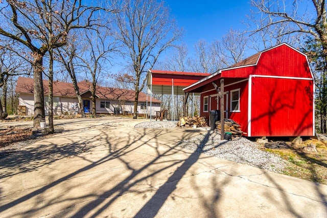 exterior space featuring a gambrel roof