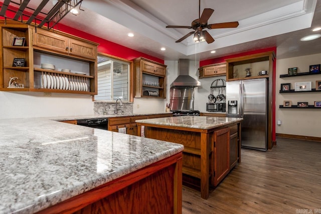 kitchen featuring open shelves, dark wood-style flooring, black appliances, a raised ceiling, and wall chimney range hood