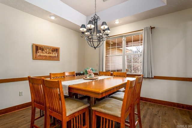 dining room with recessed lighting, wood finished floors, and baseboards