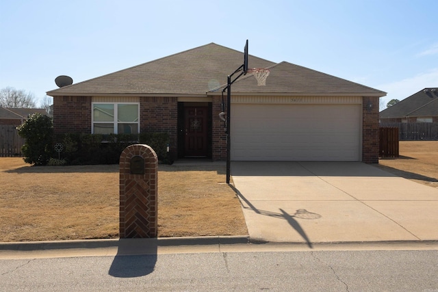 ranch-style home with driveway, fence, a shingled roof, a garage, and brick siding