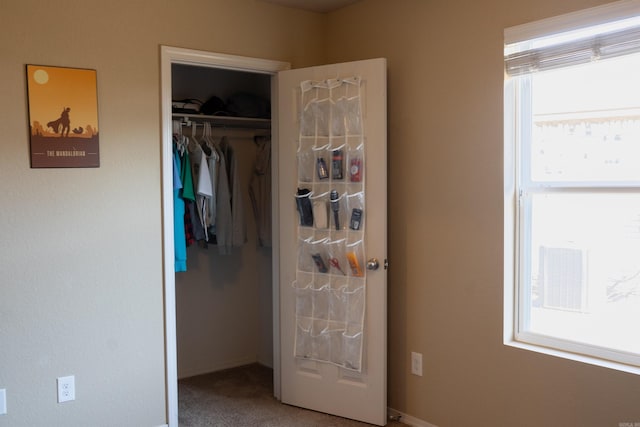 carpeted bedroom featuring a closet