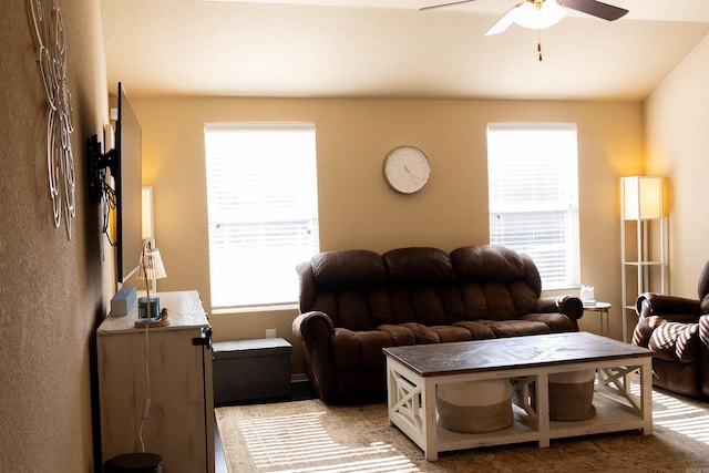 living area with a ceiling fan