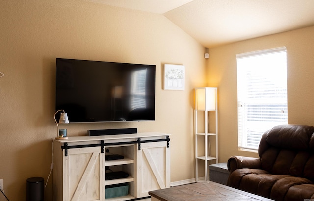 living area with lofted ceiling