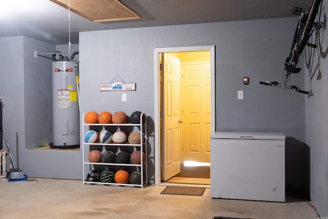 basement with refrigerator and water heater