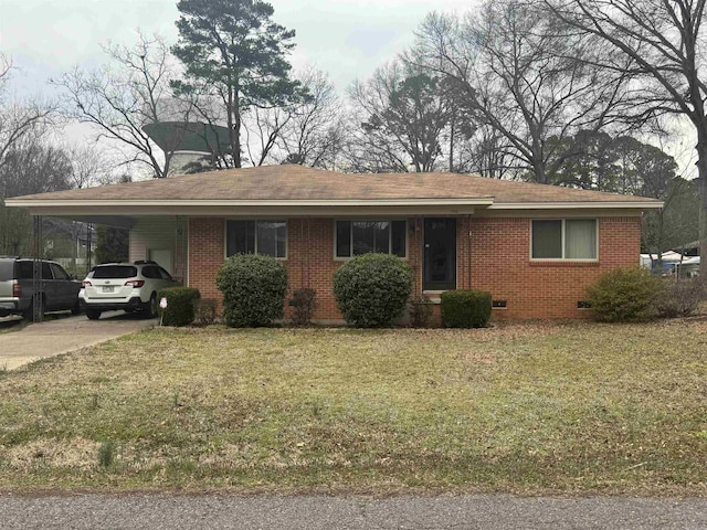 ranch-style house with brick siding, an attached carport, a front yard, crawl space, and driveway