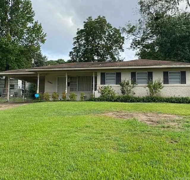 single story home featuring a front lawn and an attached carport