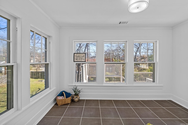 unfurnished sunroom featuring visible vents