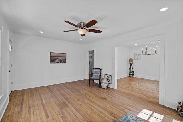 unfurnished room featuring light wood finished floors, recessed lighting, and baseboards