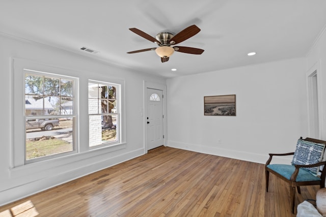 sitting room featuring a ceiling fan, visible vents, baseboards, recessed lighting, and light wood-style floors