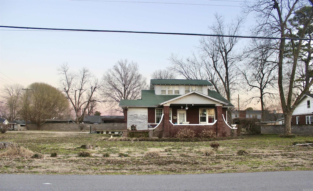 view of front of home with brick siding