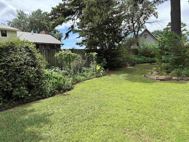 view of yard with fence