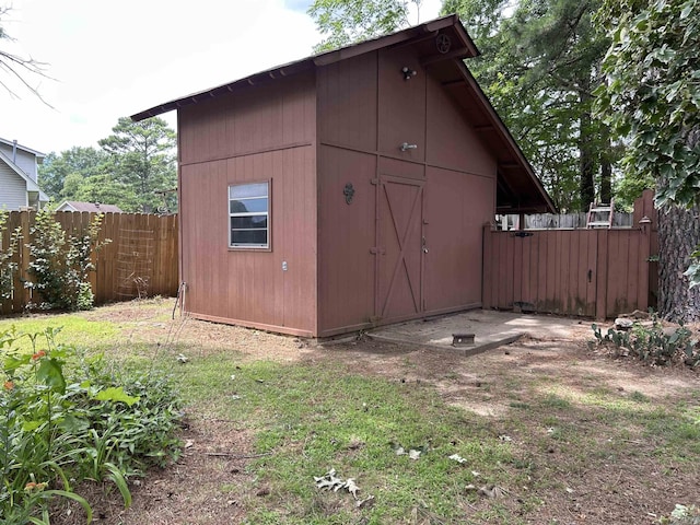 view of outbuilding featuring an outbuilding and fence