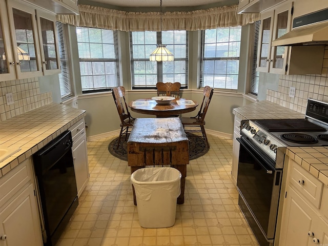 kitchen with tile countertops, white cabinetry, electric stove, under cabinet range hood, and dishwasher