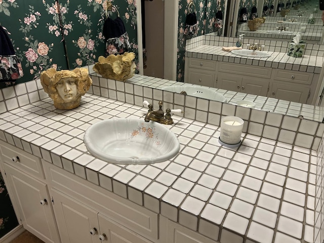 bathroom with vanity and backsplash