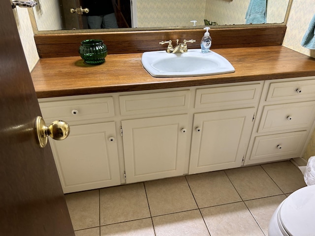 bathroom featuring tile patterned floors and vanity