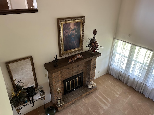 living room with light colored carpet and a brick fireplace