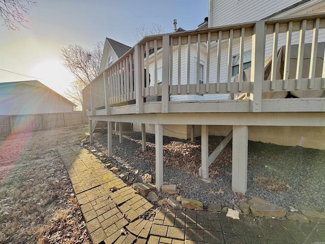 wooden terrace featuring fence