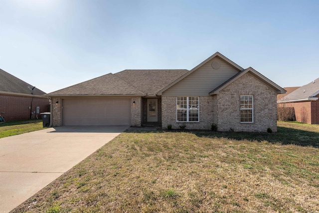 ranch-style home featuring brick siding, driveway, a front lawn, and a garage