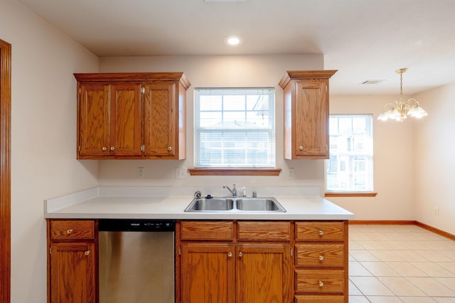 kitchen with baseboards, visible vents, a sink, light countertops, and dishwasher