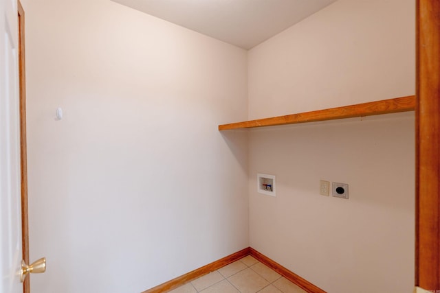 clothes washing area featuring baseboards, washer hookup, laundry area, light tile patterned flooring, and electric dryer hookup