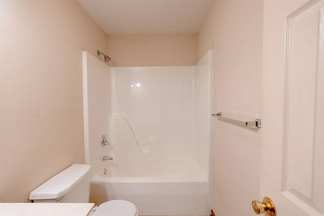 bathroom with toilet, vanity, and bathtub / shower combination