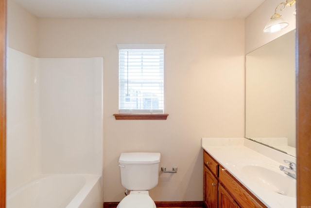 bathroom with toilet and vanity