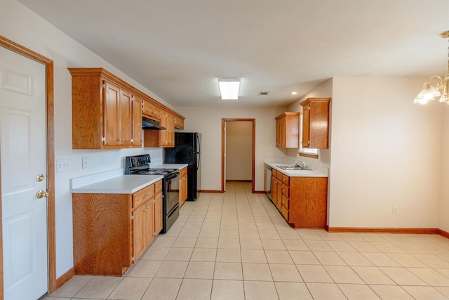 kitchen featuring under cabinet range hood, brown cabinetry, black appliances, and light countertops