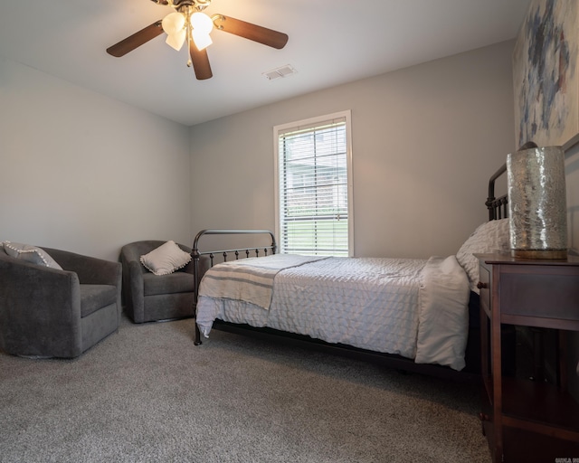 bedroom featuring visible vents, carpet floors, and ceiling fan