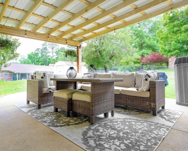 view of patio with central air condition unit, an outdoor hangout area, and fence