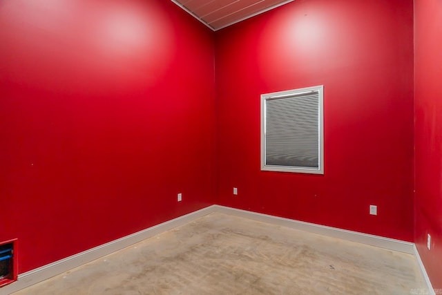 unfurnished room featuring baseboards